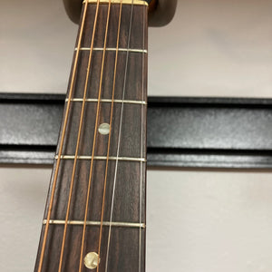 Close-up of the Gibson B-15 1967 - 1969 Natural guitar neck, showcasing its strings and vintage wear.