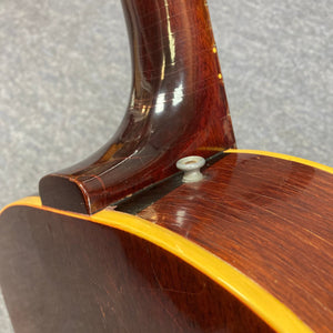 Gibson B-25 Acoustic Guitar Natural 1968 close-up, showcasing vintage craftsmanship and distinctive checking on the neck and body.