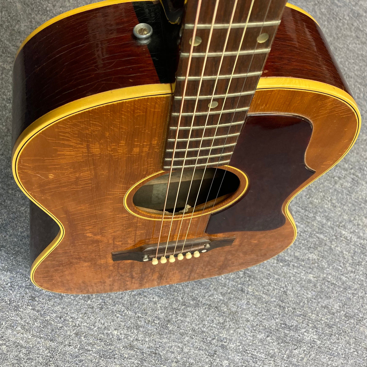 Close-up of the 1968 Gibson B25 Acoustic Guitar, highlighting its aged checking and detailed craftsmanship.