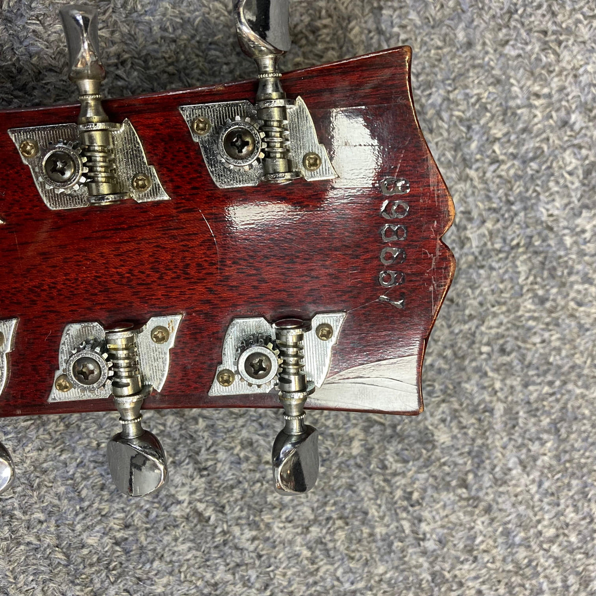 Close-up of a 1968 Gibson B25 Acoustic Guitar, highlighting its vintage checking and detailed craftsmanship.