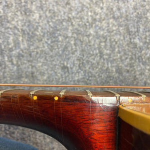 Close-up of the Gibson B-25 Acoustic Guitar neck, showcasing the vintage 1968 craftsmanship and distinctive wood checking.