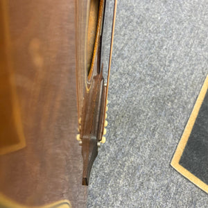 Close-up of a 1968 Gibson B25 Acoustic Guitar, showcasing vintage checking and detailed craftsmanship.