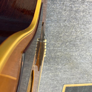 Close-up of a 1968 Gibson B25 Acoustic Guitar, highlighting its vintage checking and craftsmanship.