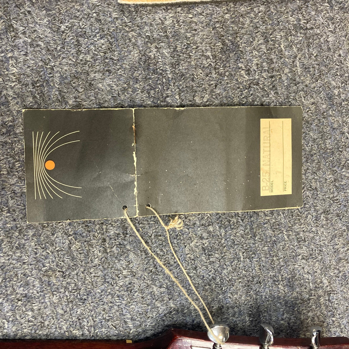 Gibson B-25 Acoustic Guitar 1968 with checking patterns, string attachments, and serial number on paper in the image context.