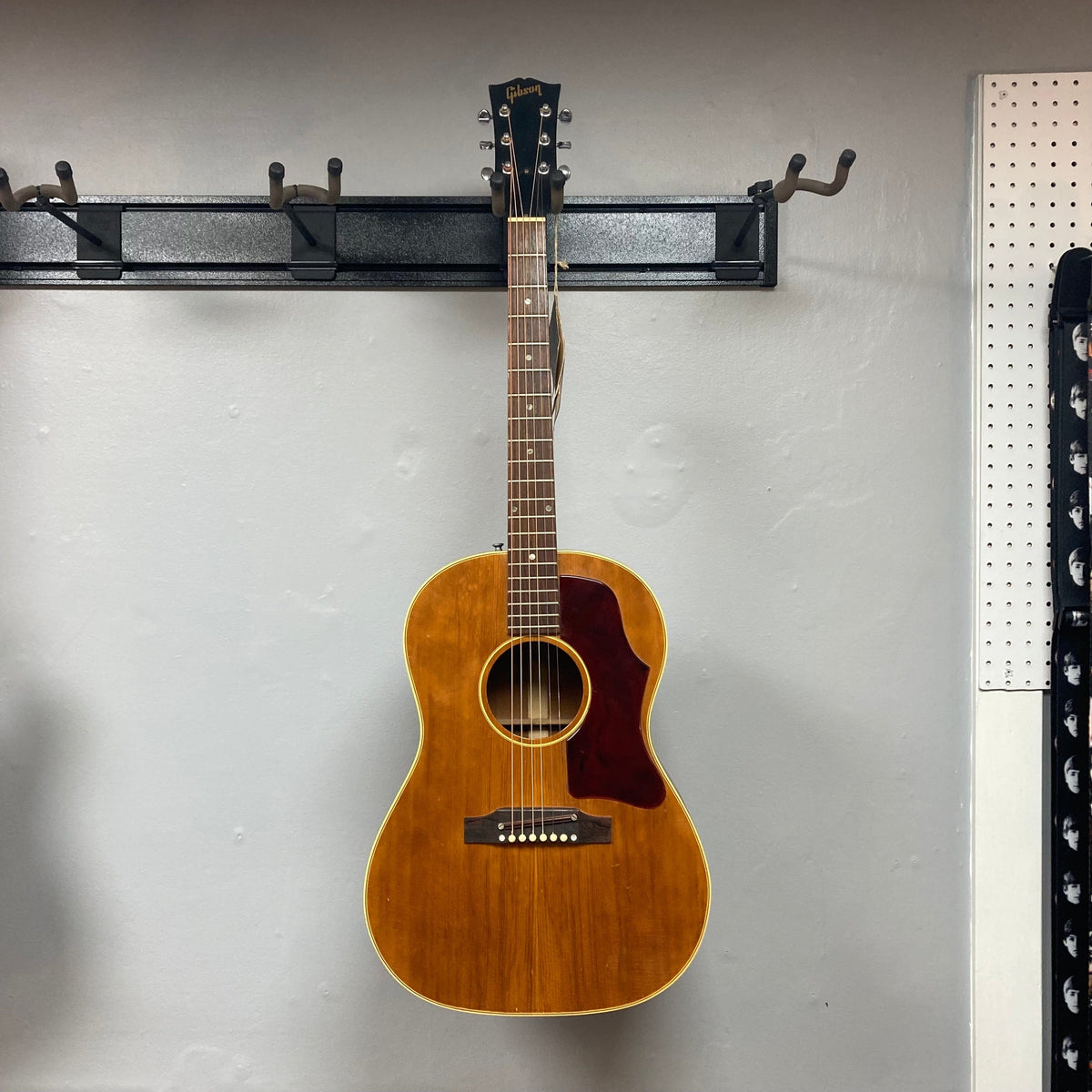 Gibson B-25 Acoustic Guitar Natural 1968 on display, highlighting its vintage checking and craftsmanship.
