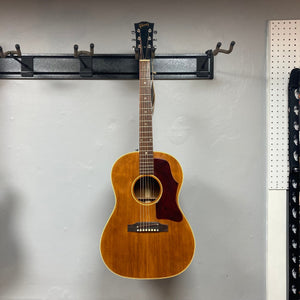 Gibson B-25 Acoustic Guitar Natural 1968 on display, highlighting its vintage checking and craftsmanship.