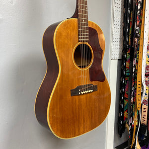 1968 Gibson B25 Acoustic Guitar with distinctive checking, showcasing vintage craftsmanship from Kalamazoo. Ideal for collectors and musicians, known for warm, resonant sound.