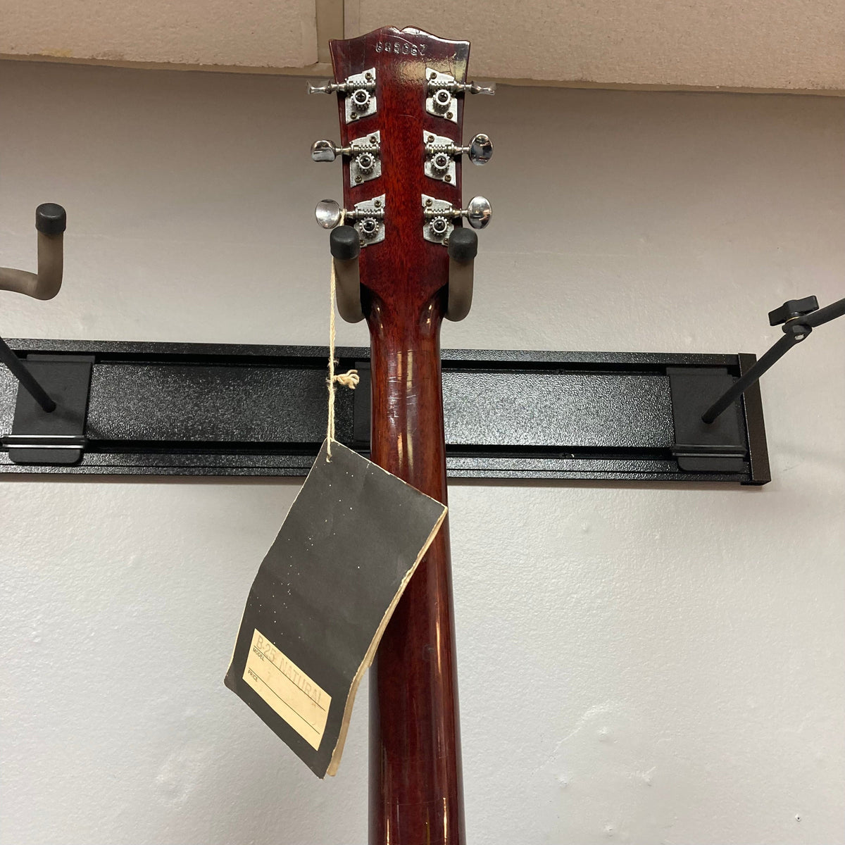 Gibson B-25 Acoustic Guitar Natural 1968 with tag, showcasing vintage checking and classic craftsmanship.