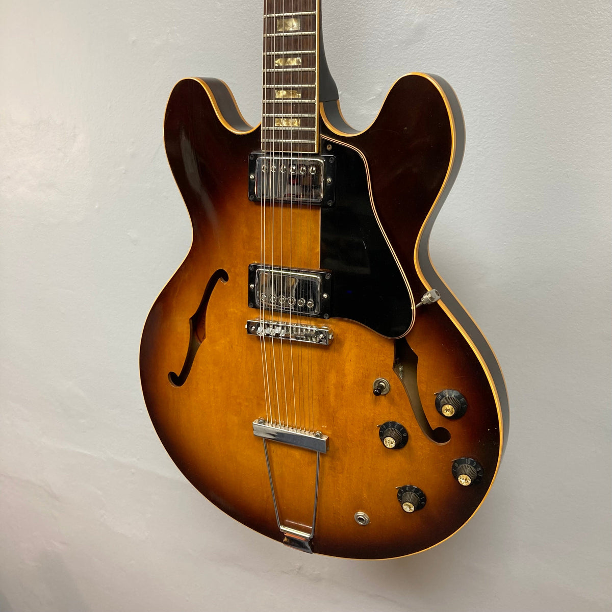 Gibson ES-335TD-12 1968 Sunburst electric guitar with semi-hollow body and 12-string configuration displayed.