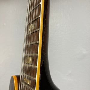 Gibson ES-335TD-12 1968 Sunburst close-up, showing strings and semi-hollow body craftsmanship.