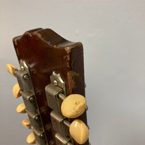 Close-up of a vintage Gibson ES-335TD-12 1968 Sunburst guitar neck and body, showcasing exquisite craftsmanship and double-cutaway design.