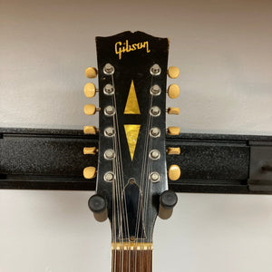 Gibson ES-335TD-12 1968 Sunburst on a stand, showcasing the guitar's head, neck, and semi-hollow body design.