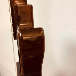Close-up side view of a Gibson Les Paul Junior 1957 Sunburst electric guitar, showing the neck and body against a plain white background.
