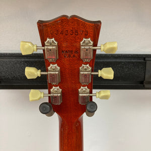 Close-up of the Gibson Les Paul Standard Premium Plus 2003 Ice Tea Burst guitar, highlighting its flamed maple top and Burstbucker Pro pickups.