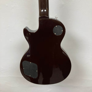 Rear view of the Gibson Les Paul Studio 2015 Desert Burst by Gibson, featuring two body access panels and upgraded locking tuners, displayed against a plain white background.