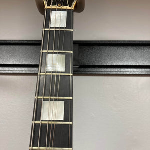 Close-up of a Gibson RD Artist 1977-1982 neck by Guitars on Main, showing rectangular mother-of-pearl inlays at the 5th, 7th, and 9th frets against a light background—an ideal collectible for vintage electric guitar fans.