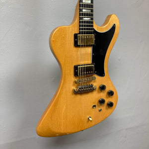 Gibson RD Artist 1977-1982 vintage electric guitar by Guitars on Main features a natural wood finish, unique body shape, black pickguard, two humbuckers, four black control knobs, and comes with case—a collectible classic for guitar enthusiasts.