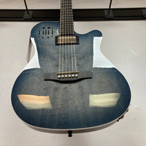 A close-up of the Godin A6 Ultra Denim Blue Flame SF with Bag, showing its cutaway body, six strings, black bridge, and glossy finish as it hangs vertically on a wall.