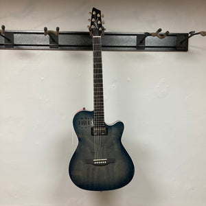 A black acoustic electric guitar with a cutaway body hangs on a wall rack, offering the same sleek appeal as the Godin A6 Ultra Denim Blue Flame SF with Bag by Godin.