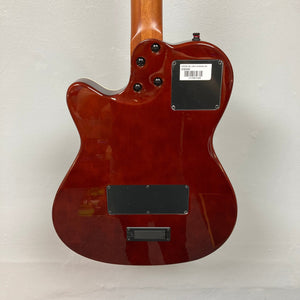 Close-up of Godin A6 Ultra Koa Extreme SF guitar, highlighting strings, neck, and metal plate with barcode.