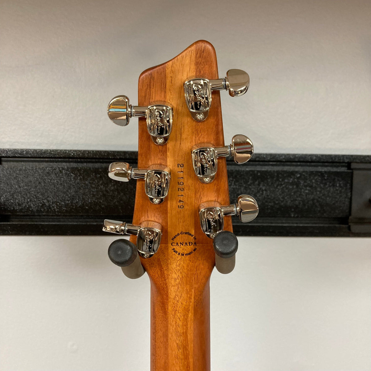 Godin A6 Ultra Koa Extreme SF guitar head with silver knobs, highlighting its innovative design and features, including dual outputs and a Custom Godin preamp.
