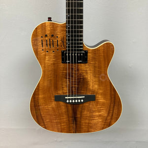 Close-up of the Godin A6 Ultra Koa Extreme SF guitar, showcasing strings and body details, highlighting its acoustic and electric features.