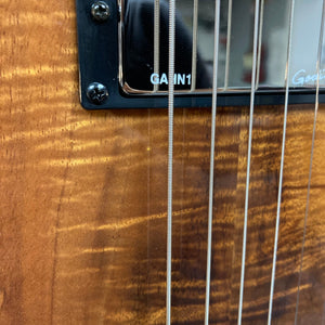 Close-up of the Godin A6 Ultra Koa Extreme SF guitar strings, highlighting the craftsmanship and innovative design for enhanced acoustic and electric performance.