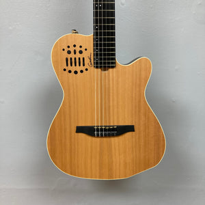 Close-up of the Godin Ltd Multiac ACS Cedar Matte SG guitar's neck and strings, highlighting its solid cedar top and custom LR Baggs electronics.