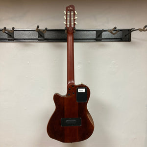 Godin Ltd Multiac ACS Cedar Matte SG w/GigBag displayed on a wall, showcasing its comfortable neck and solid cedar top design.