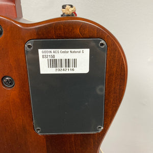 Close-up of the Godin Ltd Multiac ACS Cedar Matte SG guitar's label and barcode, highlighting its detailed craftsmanship and design.