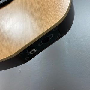 Close-up of Godin Ltd Multiac ACS Cedar Matte SG, highlighting the guitar's solid cedar top and richlite bridge, showcasing its advanced electronics and synth access capabilities.