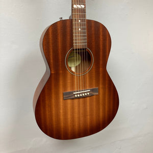 Godin Mahogany Folk Rustic Burst A/E acoustic guitar with solid Mahogany top, back, and sides, featuring Fishman Presys VT pickup, displayed on a wall.