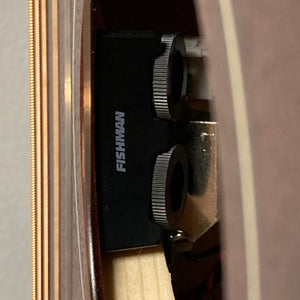 Close-up of the Godin Mahogany Folk Rustic Burst A/E guitar's solid mahogany body and intricate gear mechanisms.