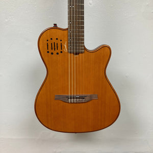 Godin Prototype Ltd Mundial Dark Cedar w/GigBag, nylon-string guitar with Silver Leaf Maple body and Cedar top, displayed against a white wall.