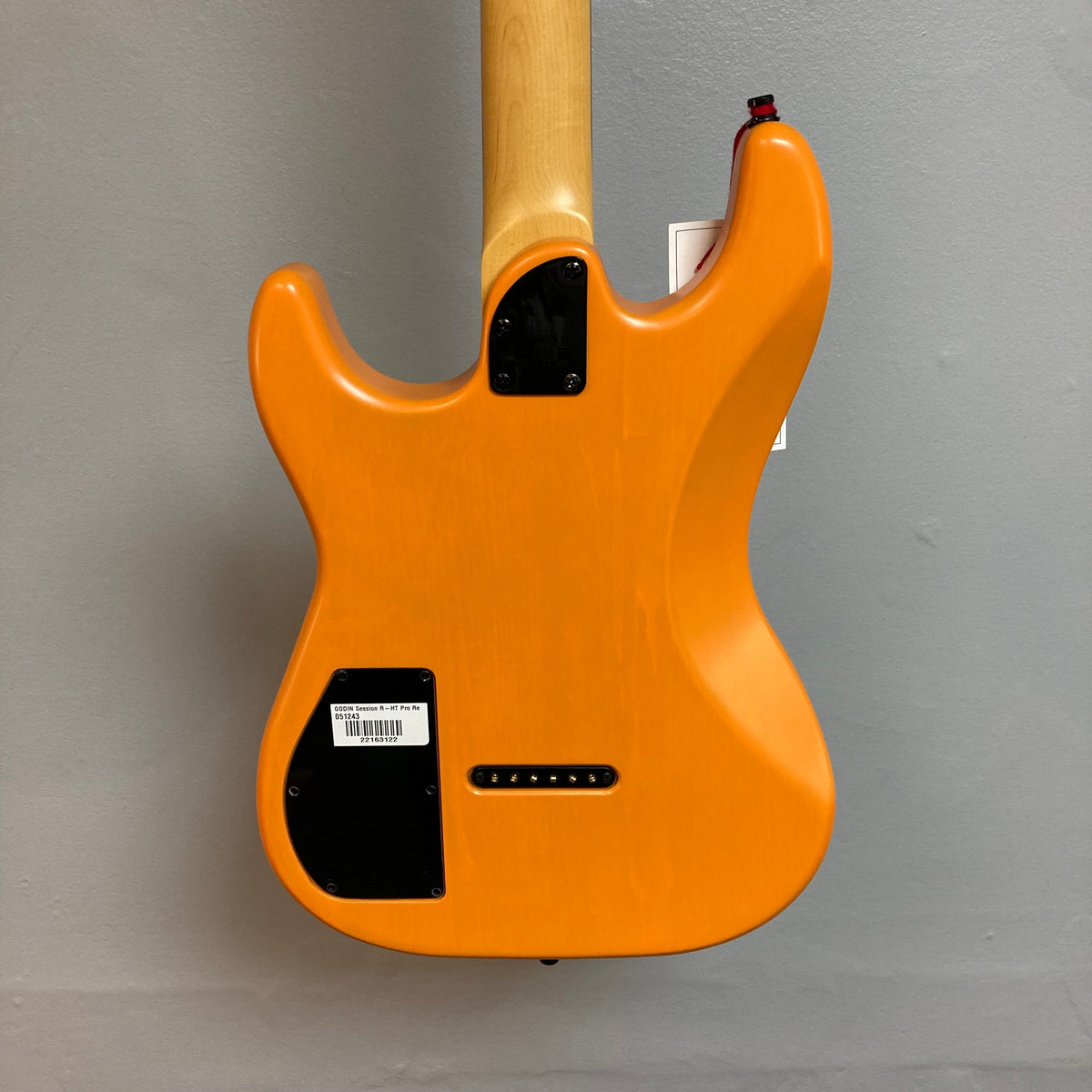 Godin Session R-HT Pro Retro Orange electric guitar with custom pickups and fixed bridge, showcased at Guitars on Main.