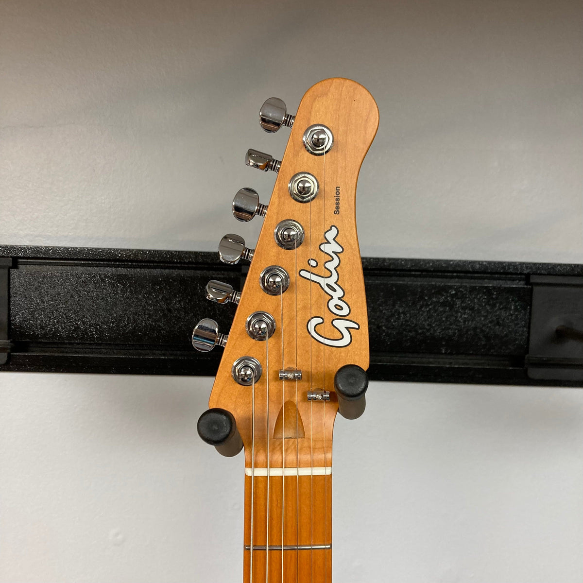 Godin Session T-Pro LTD Kanyon Burst MN guitar headstock with silver tuning knobs and logo.
