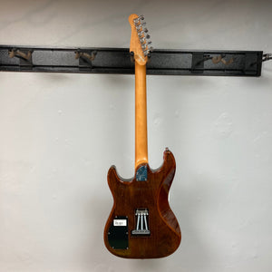 Godin Session T-Pro LTD Kanyon Burst MN electric guitar hanging on a wall, featuring H-S-S pickups and signed by Simon Godin.