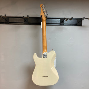 Godin Stadium Pro Ozark Cream MN Electric Guitar mounted on a wall, showcasing its sleek design and premium craftsmanship.