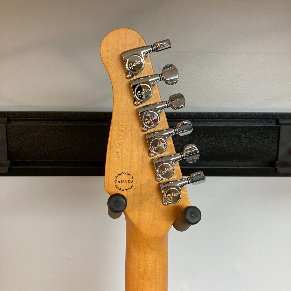 Close-up of the Godin Stadium Pro Sunset Burst MN Electric Guitar showcasing its intricate details and high-quality craftsmanship.