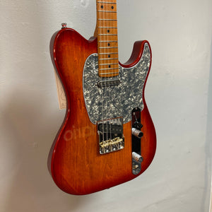 Close-up of the Godin Stadium Pro Sunset Burst MN w/GigBag Electric Guitar, highlighting its strings and pickups, showcasing its craftsmanship and high-quality components.