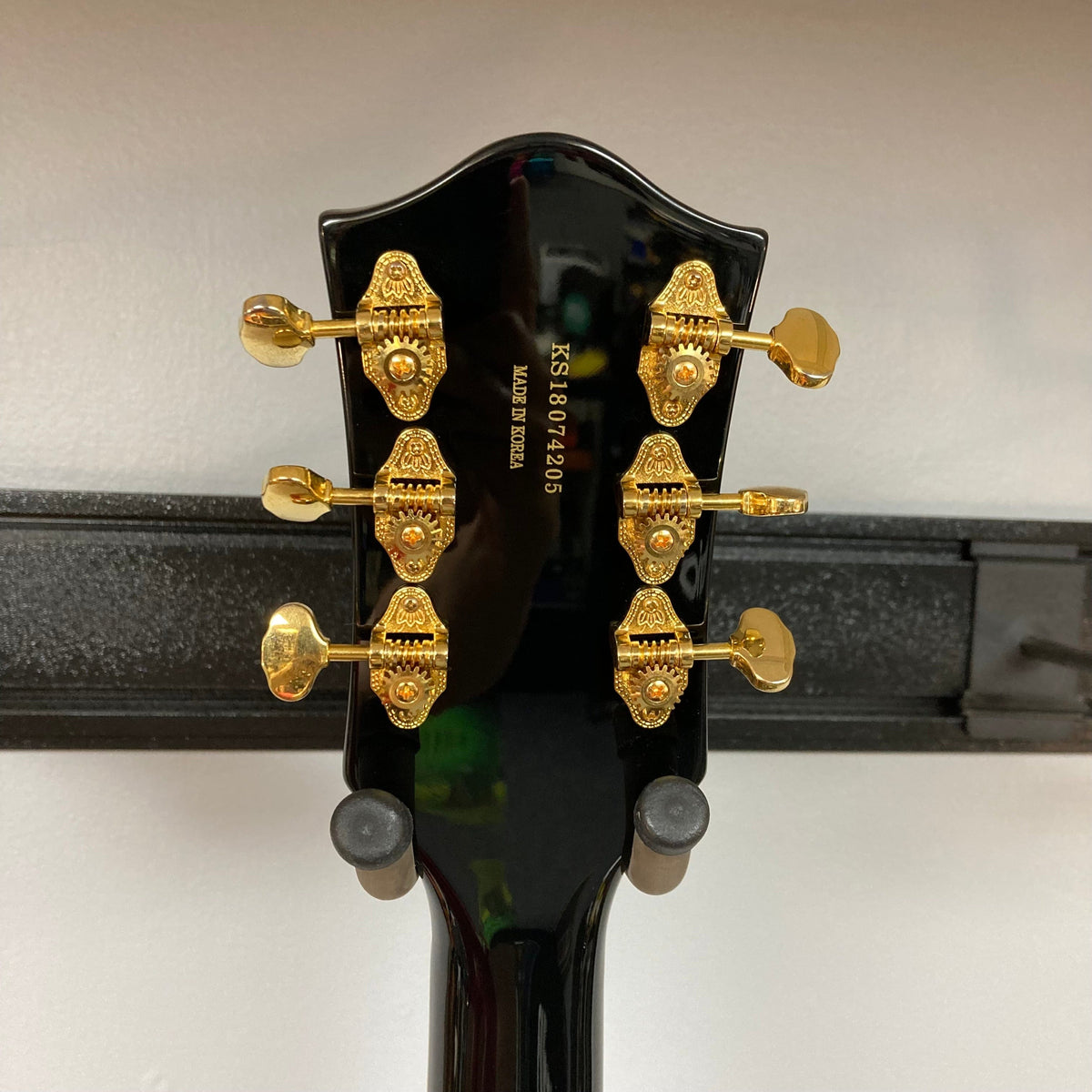 Close-up of the Gretsch G5420TG Electromatic Black Gold Used guitar, showcasing Filter'Tron pickups and a Bigsby vibrato tailpiece.