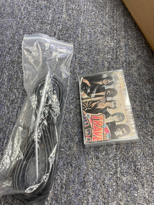 Plastic bag containing black cable, CD case of Gretsch Traveling Wilburys TW-100T Electric Guitar with original accessories on the floor.