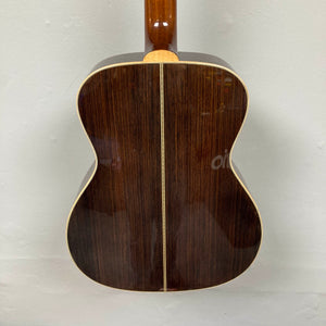 The back of the Guild Gad-30reasb w/Case, an orchestra-size acoustic-electric guitar by Guild, features a dark solid Indian rosewood finish with light binding edges and a vertical center seam, shown against a plain background.
