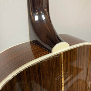 Close-up of the neck joint and back of a Guild USA F-512 w/OHSC 2005 Circa jumbo 12-string by Guild, highlighting its glossy finish, cream binding, and decorative back strip.