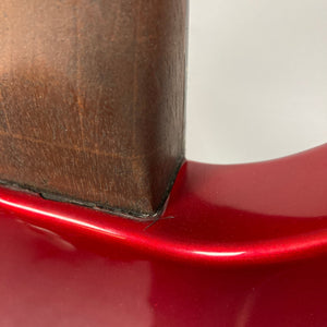 Close-up of a Guild USA X-79 Candy Apple Red guitar, showcasing its unique body shape and 24-fret fingerboard.