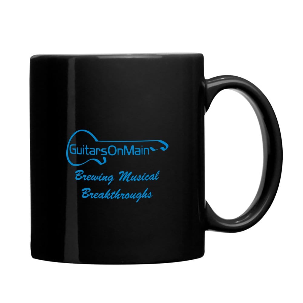 Guitars on Main Coffee Mug featuring blue text, showcasing the logo and Brewing Musical Breakthroughs mantra, ideal for music enthusiasts' morning coffee.
