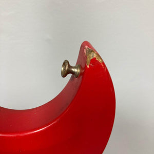 Close-up of red Hagstrom HII-B mid-1960s bass with brass knob, showing vintage wear and unique Scandinavian design features.