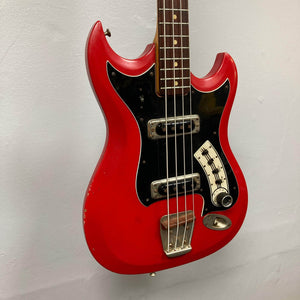 Hagstrom HII-B Mid-1960s Red Medium-Scale Bass with black pickguard, two pickups, and vintage patina, showcasing unique Scandinavian design and original hardware.