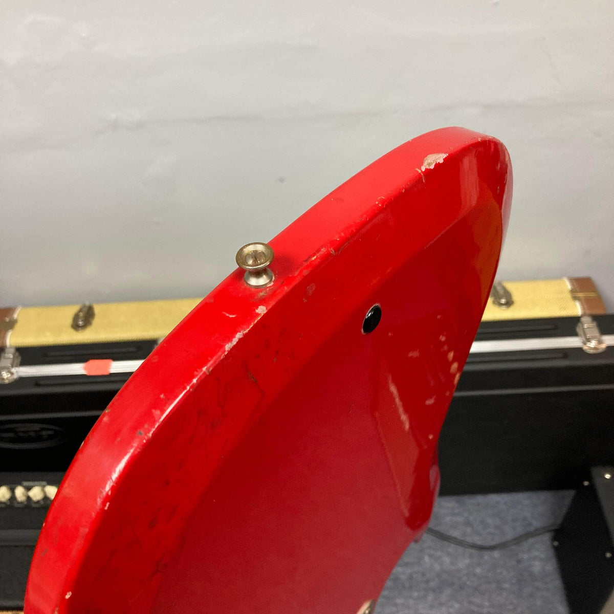 Hagstrom HII-B Mid-1960s Red Bass showing rear upper bout with strap button, minor paint chips; classic vintage appeal and unique tone.