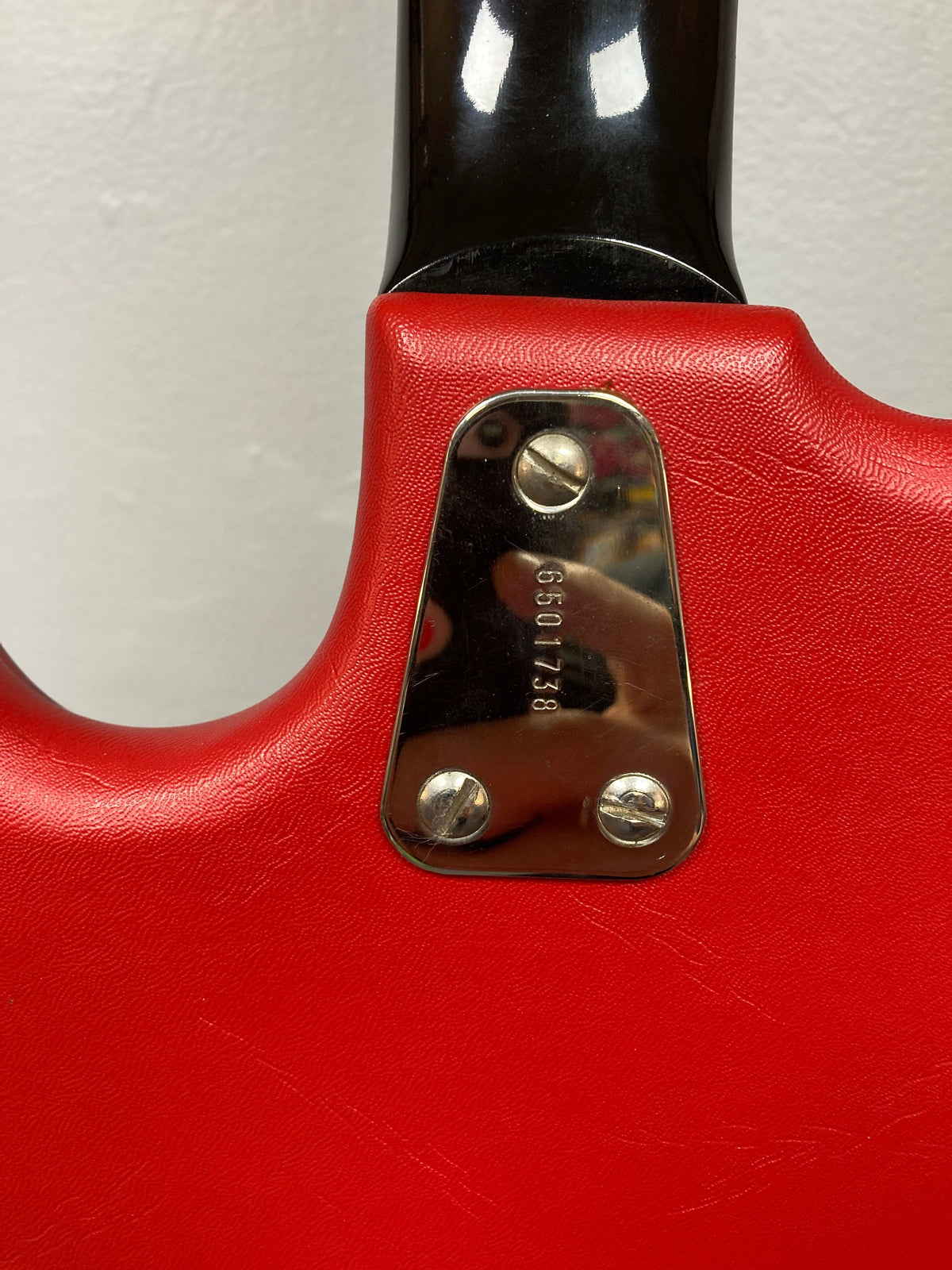 Hagstrom I Vintage Electric Guitar, close-up of red handle and screws, showcasing pristine condition with original case.